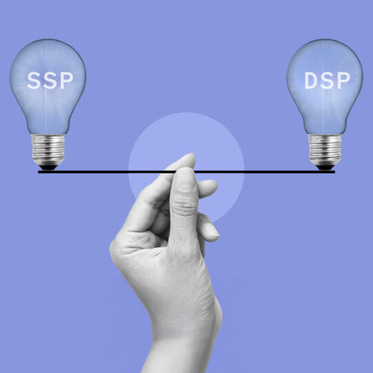 Hand holding up two lightbulbs on a wire. The words "DSP" and "SSP" are within the lightbulbs.
